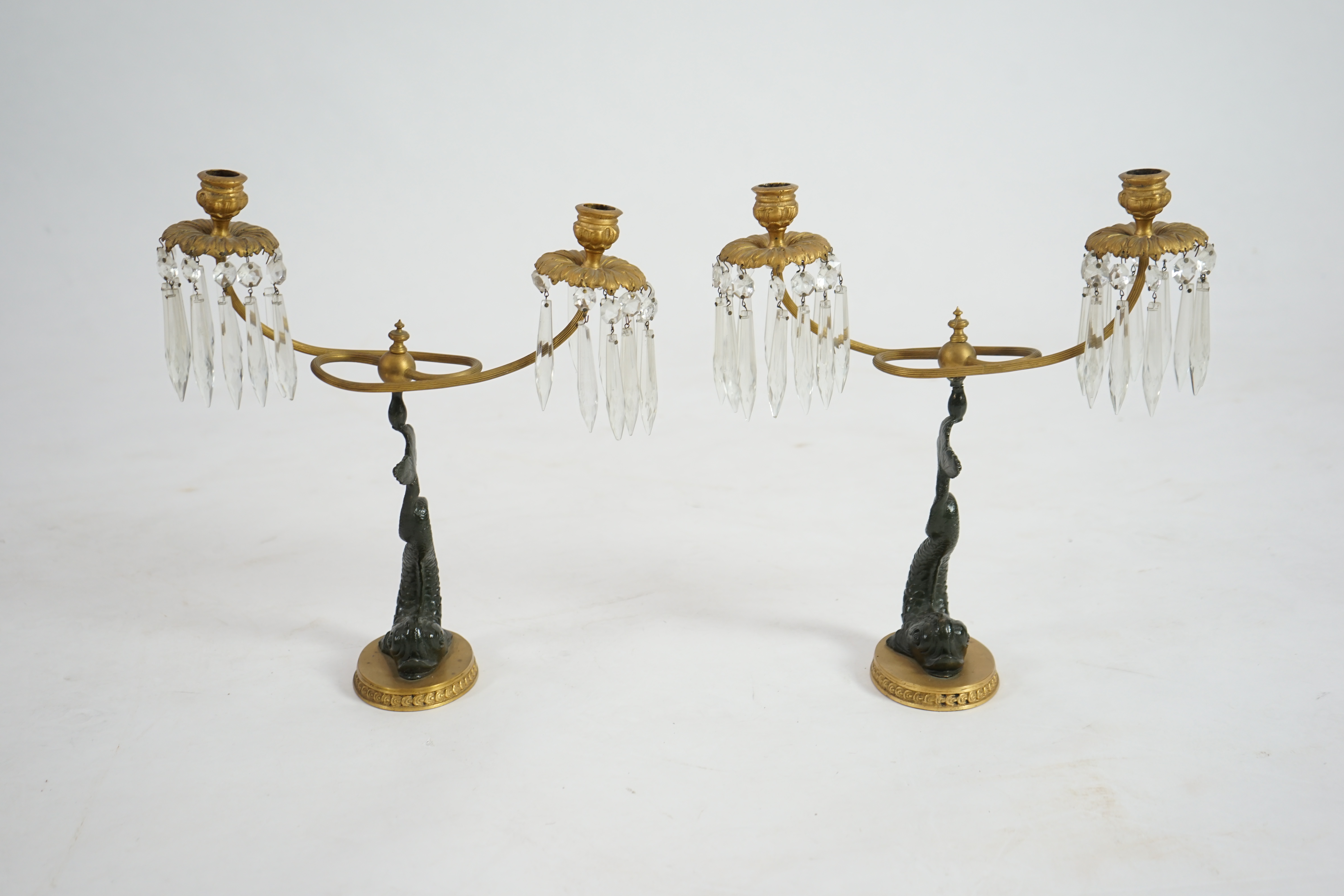 A pair of 19th century bronze and ormolu twin sconce candelabra